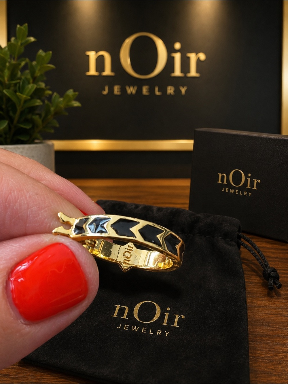 nOIr gold tone hoops with spike and black enamel inlay NWT